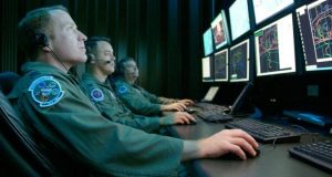 US soldiers in front of computers