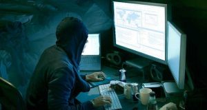 Hacker in front of a computer