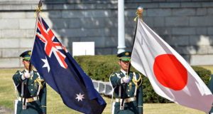 Australian and Japanese flags. Soldiers.