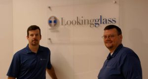 Lookingglass people in front of company logo