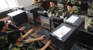 Chinese soldiers in front of computers