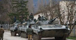 Ukrainian separatists with Russian tanks
