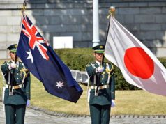 Australian and Japanese flags. Soldiers.