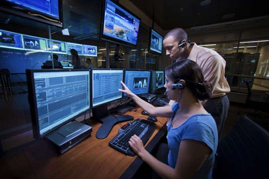 People monitoring screens