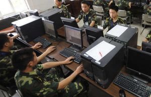 Chinese soldiers in front of computers